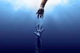 Two hands reaching underwater in a rescue attempt